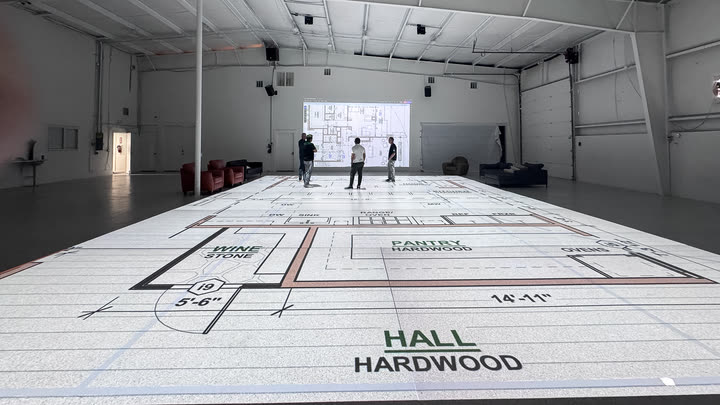 A hall projected at true width on the studio floor, labelled HALL HARDWOOD, with a 5 foot 6 inch dimension called out beside it.